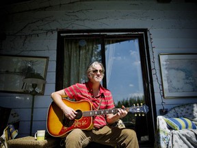 Postmedia File Photo
Canadian singer-songwriter and musician Greg Keelor poses for a portrait while playing the guitar at his country home near Kendal, Ontario.