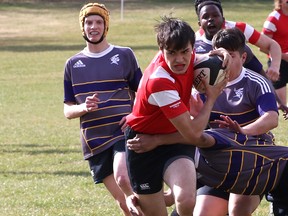 St. John Paul II took to the field behind the Jubilee Recreation Centre for their second game of the regular season against Queen Elizabeth on May 2. The two teams ended up in a tie game 17-17.