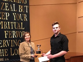 Micah Loewen, recipient of the Loreena McKennitt award from the Morden Festival of the Arts accepts congratulations from Rhonda Plett, member of the organizing committee.