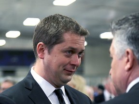 Conservative party Leader Andrew Scheer is emotional as he meets with mourners at member of Parliament Gord Brown's funeral on Thursday. (Ian MacAlpine/The Whig-Standard)