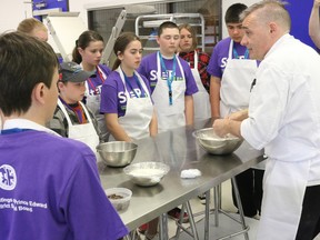 BRUCE BELL/THE INTELLIGENCER
Local Grade 7 and 8 students receive instruction on preparing tea biscuits during a culinary session at Loyalist College on Friday.