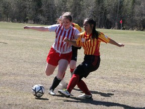 Chantal Bechard of the St. Thomas Aquinas Saints tries to cut into the goal for a scoring opportunity early in the second half of the home team's 6-0 win against the Red Lake Rams in NorWOSSA 'A' high school girls action, May 10. SHERI LAMB/Daily Miner and News/Postmedia Network