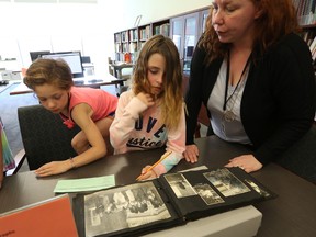 Curator JoAnne Himmelman talks to some Grade 3 Southview PS students about historic photos at the Lennox and Addington Museum and Archives on May 9, 2018. Meghan Balogh/The Whig-Standard