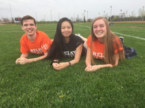 Luka Dennis, left, Monica Hu and Kaitlyn Koroscil are helping organize the second annual Relay for Life at St. Joseph’s Catholic secondary school. The event will take place on June 1 on the school’s track. (Laura Broadley/Times-Journal)
