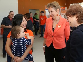 Provincial Nickel Belt NDP candidate France Gelinas, middle, chats with Miyako Chen and her son, Curtis, 19 months, and Marie Thompson at the opening of Gelinas' campaign office in Val Caron on Friday. John Lappa/Sudbury Star/Postmedia Network