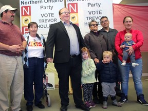 Trevor Holliday, centre, speaks while surrounded by Northern Ontario Party supporters and his family as the Nipissing Riding candidate officially opened NOP's first-ever provincial election campaign office in North Bay, Friday. 
Dave Dale / The Nugget