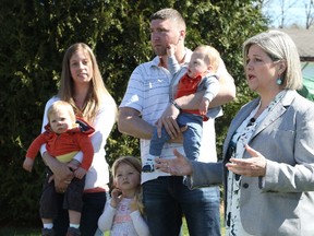 Ontario NDP leader Andrea Horwath speaks during a campaign stop as Emily Heath and her fiancee Max Lafontaine and their children Logan, Xavier and Genevieve look on in Sudbury, Ont. on Saturday, May 12, 2018. THE CANADIAN PRESS/Gino Donato