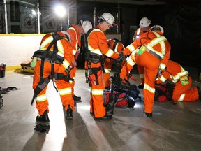 Team Tahoe has won the overall Timmins District Mine Rescue competition which was held this past week at the Archie Dillon Sportsplex. The team, shown in this photo preparing for their event on Wednesday, was among seven Northern mine rescue teams that took part in two district competitions. Tahoe has won the right to compete at the all-Ontario mine rescue competition which will be held at the Alamos Young-Davidson Mine in Matachewan in June.  LEN GILLIS / Postmedia Network