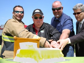 Tim Miller/The Intelligencer
(From left) Quinte West firefighter Duty Captain Chris Wigley, Mayor Jim Harrison, Mike Eden of Leon's Trenton and Trenton Memorial Hospital Foundation chairman Phil Wild cut a bed-shaped cake at the kickoff of the Leon's Trenton Buy-A-Bed Campaign on Saturday in Quinte West.
