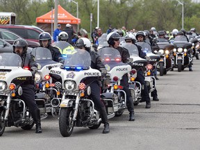 Police officers on motorcycles from Brantford Police, Brant OPP and police services from surrounding jurisdictions lead hundreds of bikers heading out from the civic centre on a 70-kilometre ride on Saturday at the 14th annual Lansdowne Charity Motorcycle Ride in Brantford. The fundraising ride supports the children's centre's Every Kid Counts program. 
Brian Thompson/The Expositor