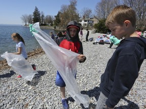 Rideau Public School Grade 4 students cleaned up garbage at the beach near the Kingston Yacht Club last week. The class received a grant last year from World Wildlife Fund-Canada to learn more about plastics and microplastics in waterways. (Meghan Balogh/The Whig-Standard/Postmedia Network)