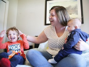 Meg Kant of Northern Mama Maternal Services, formerly the Blissful Doula, plays with her kids Gibson and Miller last May. (Gino Donato/Sudbury Star file photo)