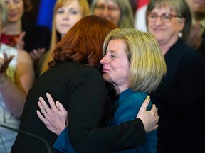 Carlynn McAneeley (left), a survivor of sexual violence, is hugged by Alberta Premier Rachel Notley (right) at the Alberta Legislature on May 1.

Larry Wong/Postmedia Network