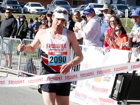 Eric Leishman crosses the finish line first in the half marathon at the 2018 SudburyROCKS!!! Race, Run, or Walk for Diabetes in Sudbury, Ont. on Sunday May 13, 2018. Gino Donato/Sudbury Star/Postmedia Network