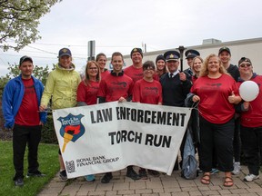 The group of runners which began the Flame of Hope's three kilometer journey from Tim Horton's on Simcoe Street to Broadway. (Chris Funston/Sentinel-Review)