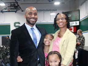 Damian Devonish celebrates his new Canadian citizenship with wife Cecilia and their two daughters Destiny (center) and Dasha (right) during a ceremony at St. Patrick's High School on May 8.
CARL HNATYSHYN/SARNIA THIS WEEK