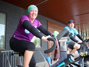 Carolyn Eltervoog and Scott Morrison get a sweat going during their bike-a-thon in promotion of the upcoming Ride Don't Hide fundraiser for local mental health programs on June 24. (Chris Funston/Sentinel-Review)