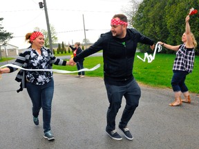 Beth Hendershot and Cody Smith cross the finish line at the Norfolk Association for Community Living's Amazing Race competition May 11. JACOB ROBINSON/Simcoe Reformer