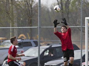 BCI goalkeeper Sam Drekic goes up to catch a shot on net during a high school boys soccer semifinal match against Paris District High School on Monday at Wifo Field in Paris. (Brian Thompson/The Expositor)