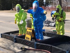 North Bay firefighters donned Level A protection HazMat suits Monday to isolate and stop a chlorine leak at the city's sewage treatment plant on Memorial Drive.  Supplied Photo