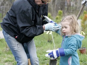 Isla Linklater, 3, spent Tuesday morning with her grandmother Bonnie Baldwin planting trees along the Chippewa Creek EcoPath.