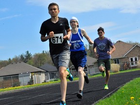 Lucas Jones of Holy Trinity paces Simcoe's Brody McKnight and Tanner Lammens of Valley Heights during Monday's NSSAA 3000m race at Holy Trinity. Jones and McKnight finished 1/2 in the senior division while Lammens was second in the junior event.
JACOB ROBINSON/Simcoe Reformer