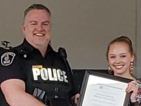Submitted Photo
Constable Mark Hall of the Belleville Police Service was awarded a Community Champion Award last week for his ongoing work in the community, particularly in terms of mental health. Hall was presented the award by the Canadian Mental Health Association’s housing coordinator Cassidy Hill.