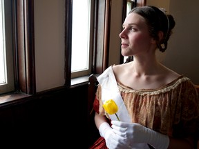 Historical interpreter Jessica Fraser, dressed as a young Queen Victoria, gazes out a church window at Fanshawe Pioneer Village. The attraction at Fanshawe Conservation Area continues a long-standing tradition this long weekend by celebrating Queen Victoria’s birthday. (CHRIS MONTANINI\LONDONER)