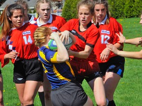 Alex Mackay of Waterford and Delhi's Calissa Nowe battle for posession of the ball during the NSSAA rugby semi-finals Tuesday at WDHS. The Wolves scored two late tries to win the game 15-14.
JACOB ROBINSON/Simcoe Reformer
