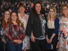 Kara Fulton (left to right), Victoria-Lynn Scattergood, Marie Lauer, Crystal Boys, and Katherine Funk pose with Editor-In-Chief of Airdrie Life Sherry Shaw-Froggatt as this year's Amazing Airdrie Women Award recipients.