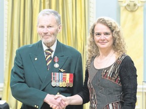 Garry Hunt (left) receives Sovereign’s Medal for Volunteers from the Governor General of Canada, Julie Payette (right) on April 17 in Ottawa.