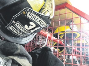 A stall with gear for Canmore firefighters. The helmet belongs to firefighter Hutchison, a dedicated part-time firefighter for years before becoming full-time, fire chief Walter Gahler notes.