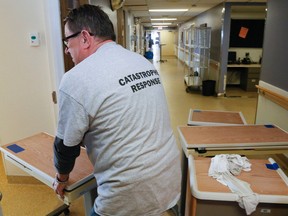 Luke Hendry/The Intelligencer
Steve Kowalczyk of FirstOnSite Restoration Ltd. returns a patient table to a room on the Quinte 5 floor of Belleville General Hospital Friday, May 11 in Belleville. The floor was damaged in a May 8 fire and is expected to be out of service until the week of July 9.