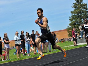 Delhi's Daunte Henriques runs his way to setting a new senior boys 100m record at the NSSAA Track and Field Championships at Holy Trinity on Wednesday.
JACOB ROBINSON/Simcoe Reformer
