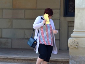 Tracy Arthur leaves the Elgin County Courthouse after her appearance Tuesday. The Aylmer woman was charged with theft last year after an extensive probe into the finances of a volunteer council at New Sarum Public School. (LOUIS PIN, Times-Journal)