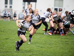 Hannah Forget carries the ball for the Owen Sound District Wolves varsity girls rubgy team against the Grey Highlands Lions in this file photo. The Wolves won the Bluewater Athletic Association championship on Monday by beating the St. Mary's Mustangs, 41-0, in the final. Greg Cowan/The Sun Times