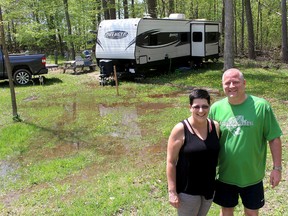 Tracey and Duane Cowen will be high and dry in their camper trailer, but the ground around their seasonal site at the C.M. Wilson Conservation Area, south of Chatham, Ont., is saturated with water. Despite the wet start to the camping season, the Chatham couple are looking forward to spending the season at the campground. Photo taken Wednesday May 16, 2018. (Ellwood Shreve/Chatham Daily News)