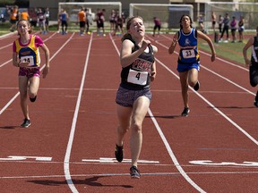 Brooke Morton of Paris District High School crosses the finish line with a time of 12.81 seconds to win the midget girls 100-metre final on Wednesday during the Brant County high school track and field meet at Kiwanis Field in Brantford. (Brian Thompson/The Expositor)