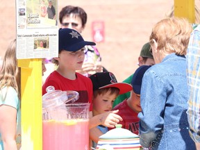 TIMES FILE PHOTO. Tate Barton sells lemonade at the 2017 Little Britches Parade. The philanthropist has raised in advance of $33,000, all of which is directed toward cancer care at the High River Hospital.