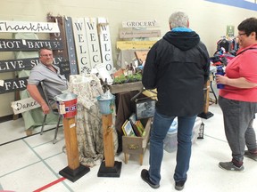 Photo by LESLIE KNIBBS/FOR THE STANDARD
Customers at the St. Mary Vendor Fair checking out some crafts from Rustic Chic out of Spragge.