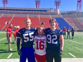 Brenden Palmer (left), Hunter Goulet (centre) and James Clarke, former Hanna Hawks football players, tried out with 120 other hopefuls to join the Calgary Colts. Despite the sheer number of players, the trio impressed the coaches, earning each of them a position on the roster.