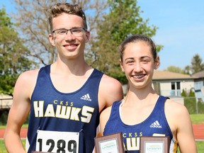 Tye Douma, left, and Emma Pegg of the Chatham-Kent Golden Hawks were chosen the athletes of the meet at the LKSSAA track and field championship at the Chatham-Kent Community Athletic Complex in Chatham, Ont., on Wednesday, May 16, 2018. (MARK MALONE/Chatham Daily News/Postmedia Network)