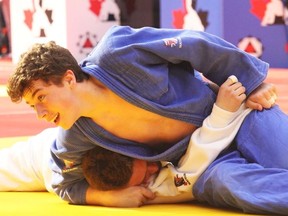 Fort Saskatchewan’s Tolide Judo Kwai’s Nick Gagnon tries to sweep his opponent off his feet during the 13th annual Edmonton International Judo Championship. Gagnon landed gold in the U18 -73 kilogram category. He is currently recovering from an injury.
