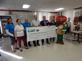 Maizex Seeds announced in Ridgetown on Wednesday it will contribute $11,800 to the Chatham-Kent International Plowing Match and Rural Expo. From left are Donna Nolan, IPM co-ordinator Allison Terfloth, Don Bird, Stephen Denys, director of business management for Maizex, IPM co-chair Darrin Canniff, James Dow and mascot Tobe Cobe Jr. (Handout)