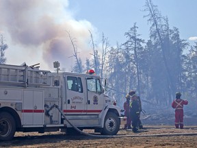 Large clouds of smoke could be easily seen from Highway 15 as Strathcona County’s fire department tried to battle a massive grass fire on Sunday, May 13, 2018.  Fire crews would spend the entire weekend trying to get a handle on the fires.