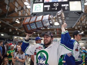 Kole Gable raises the Ed Chynoweth Cup over his head after winning the Western Hockey League Championship on May 13, 2018, in Swift Current, Sask. Supplied image/Robert Murray/WHL