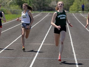 Stratford Central's Ashlynn Gilhula, middle, runs to a first-place finish in the midget girls 200m race at the Huron-Perth track and field championships Wednesday in Clinton. Gilhula won four gold medals at the two-day meet and qualified for WOSSAA next week in London. (Cory Smith/The Beacon Herald)