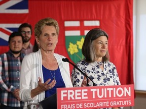 Ian MacAlpine/The Whig-Standard
Ontario Premier Kathleen Wynne, left, speaks at a campaign stop at St. Lawrence College on Thursday. With Wynne is Kingston and the Islands MPP Sophie Kiwala.