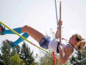 Anna Foreman Willms of the Kingston Blues sets a record of 2.60 metres in the senior girls pole vault at the Kingston Area Secondary Schools Athletic Association track and field championships at the CaraCo Home Field complex on Thursday. (Wyatt Brooks/For The Whig-Standard)