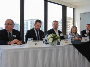 Kingston and the Islands provincial election candidates, from left, Gary Bennett (Progressive Conservative), Ian Arthur (NDP), Andre Imbeault (Trillium), Sophie Kiwala (Liberal) and Robert Kiley (Green) are seen before an all-candidates luncheon hosted by the Greater Kingston Chamber of Commerce at the Delta Hotel on Thursday. )Julia McKay/The Whig-Standard)
